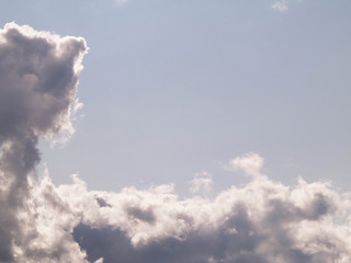 Photo of dark clouds on blue sky.
