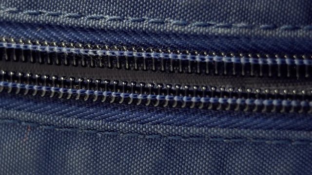 Unzipping Zipper On The Backpack