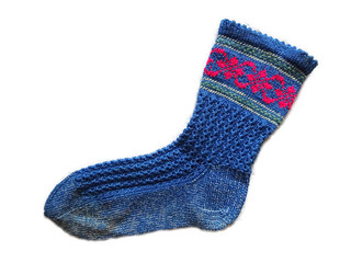 Hand knitted handmade blue color with pattern textured single isolated wool woolen warm sock on the white background 