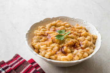 Keskek Traditional Food made with Wheat, Meat and Fried Butter Sauce.