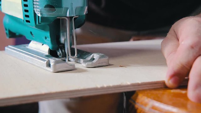 Plywood cutting. Working with  electric fret saw
