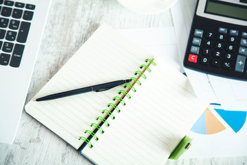 notepad with calculator and keyboard