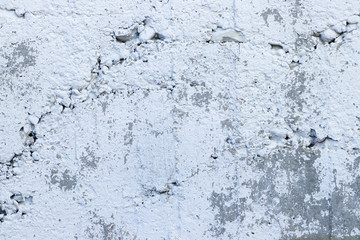 Texture of old concrete surface covered with white paint. Empty grunge background.