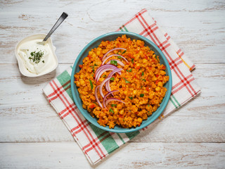 Bulgur wheat pilaf with chickpeas and vegetables.

