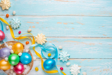Easter background, with colored eggs and sweets