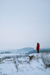 man on the cliff with beautiful winter landscape view
