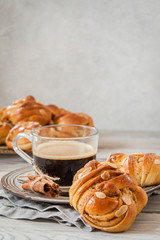 Swedish fika: cinnamon buns with a cup of coffee.