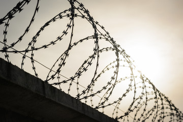Barbed fence on the border between countries. Defensive wall for protection sovereignty of the country from enemies during the war