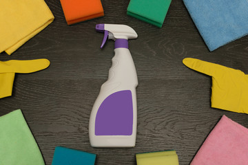 goods for cleaning the house on a wooden background