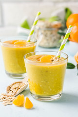 Citrus golden oat smoothie. Selective focus, space for text.