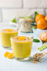 Citrus golden oat smoothie. Selective focus, space for text.