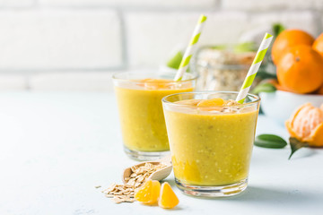 Citrus golden oat smoothie. Selective focus, space for text.