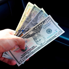 Hand transmitter dollars. Transferring money out of the hands. A