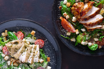 Salad with fried chicken and turkey  fillet , composition with two plates