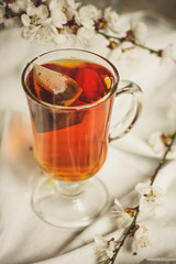 tea, hot drink (against the background of flowers). copy space