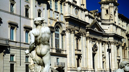 View of the church of Sant'Agnese with marble statues of a fountain in the foreground
