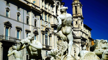 View of the church of Sant'Agnese with marble statues of a fountain in the foreground