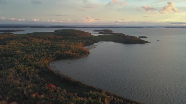 Aerial panoramic landscape view of a beautiful bay on the Great Lakes, Lake Huron, during a vibrant sunset. Located Northwest from Toronto, Ontario, Canada. Still Image Continuous Animation