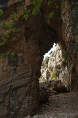 Rock arch on trekking trail at Imbros gorge near Chora Sfakion, island of Crete, Greece