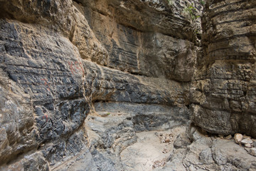 Trekking on a winding path through Imbros gorge near Chora Sfakion, island of Crete, Greece