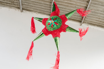 Traditional colorful pinata star shape from mexico. Important part of parties and celebrations in...
