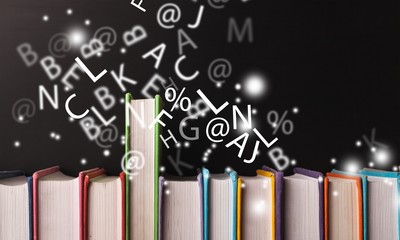 Old books in row on dark  background