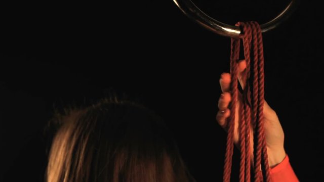 Shibari art with red ropes
