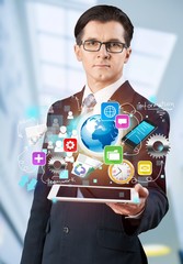 Businessman and  business symbols on  background