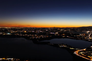 Night view panorama at sunset over northern Lombardy from the Alps