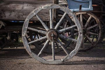 Fototapeta na wymiar Wooden wheel of vintage wagon