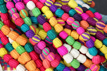 Hand made necklace made with woven straw, South America.