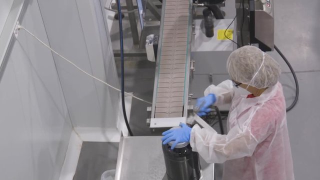 Birds eye view female worker, assembly line Beverly Nutrition Factory, Madrid