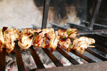 Barbecue close-up photo. Delicious chicken meat grilling outdoors