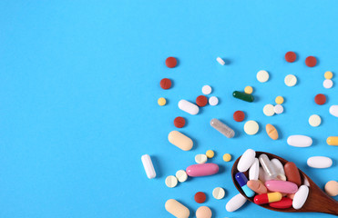 background of many multi-colored medical pills top view