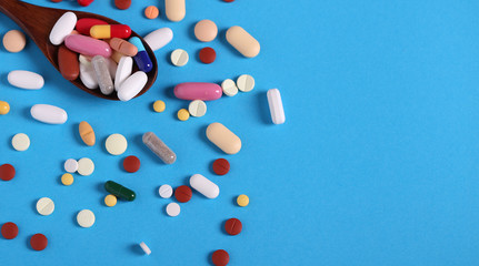 background of many multi-colored medical pills top view