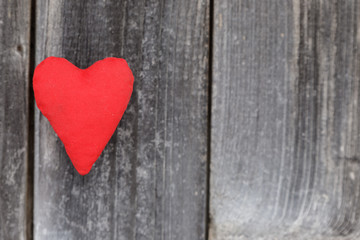 Valentine day, red handmade heart on grey wood background.Valentine's Day card.