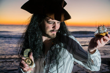 Portrait of handsome male pirate of the evening sea as a symbol of tourism and travel