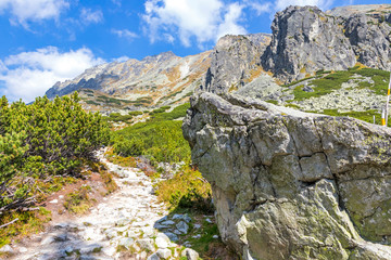 Hiking in High Tatras Mountains (Vysoke Tatry), Slovakia. Mlynicka Valley. On the way to Skok waterfall (1789m) (Slovak: Vodopad Skok). Sunny autumn day © katatonia