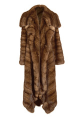 Beautiful female long brown fur coat, from natural mink fur isolated on white