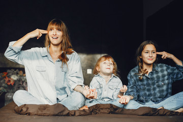 Mother with daughters at home
