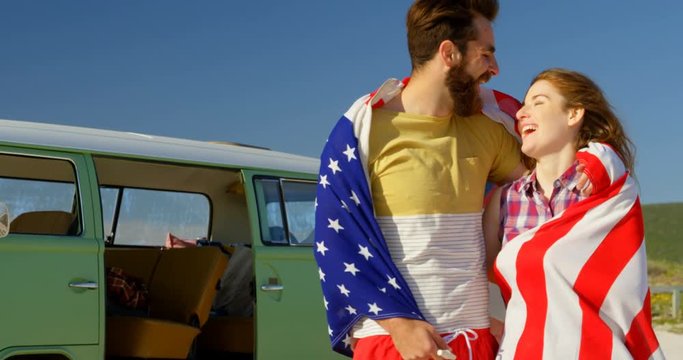 Happy man kissing woman forehead at beach on a sunny day 4k