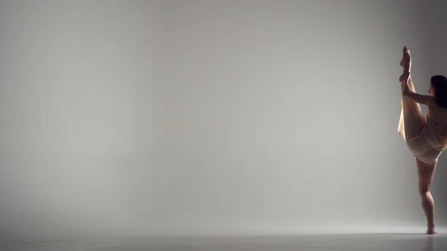 Beautiful woman freestyle dancing in studio