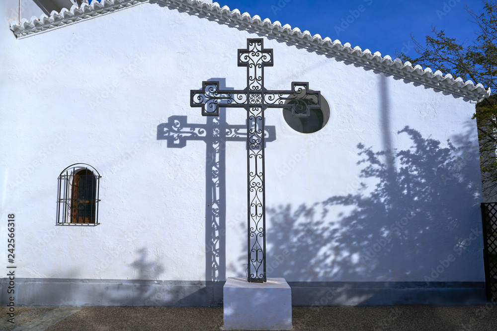 Wall mural Guadix church cross in Granada Spain