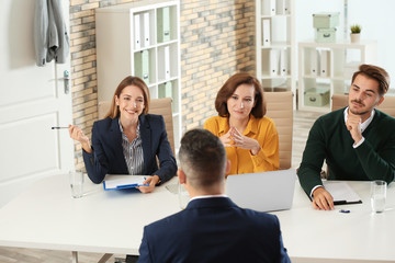 Human resources commission conducting job interview with applicant in office