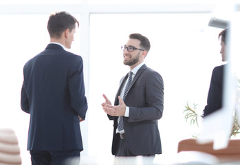 employees of the company standing in the office