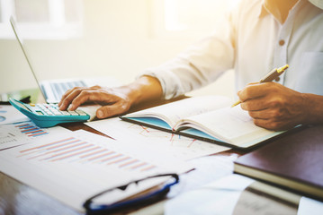 Accountant man calculating tax expense financial statement.