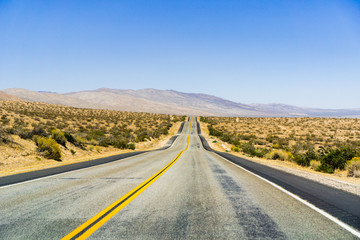 Fototapeta na wymiar Highway through the Mojave Desert, California
