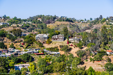 Fototapeta na wymiar Scattered houses on one of the hills of Bel Air neighborhood, Los Angeles, California