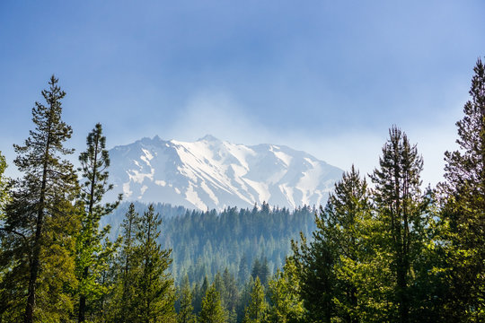Smoke carried by the wind from the nearby wildfires covering Lassen Volcanic National Park; Lassen Peak visible in the background, Northern California