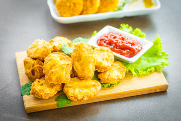 Deep fried chicken meat call nugget with tomato or ketchup sauce